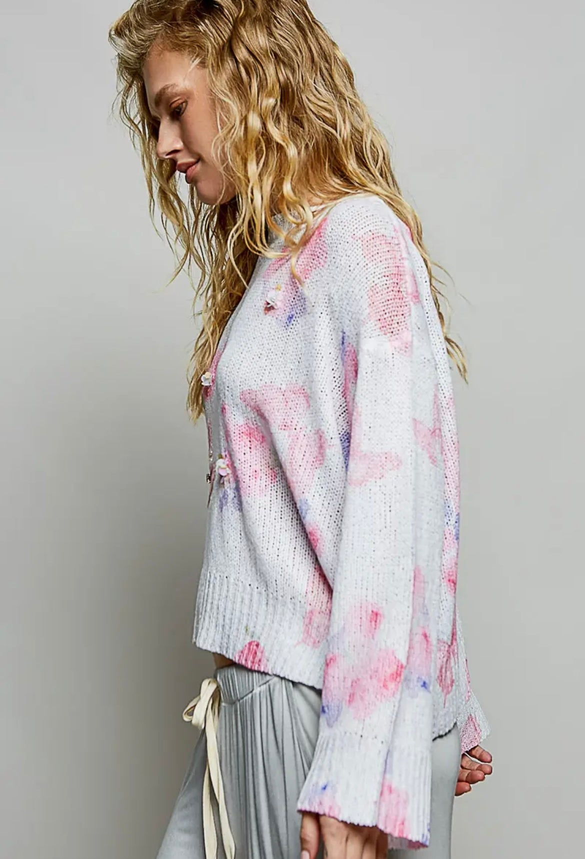 POL, ivory butterfly print sweater with sequin flower details.