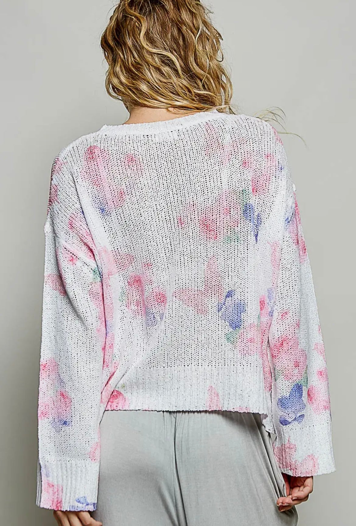 POL, ivory butterfly print sweater with sequin flower details.